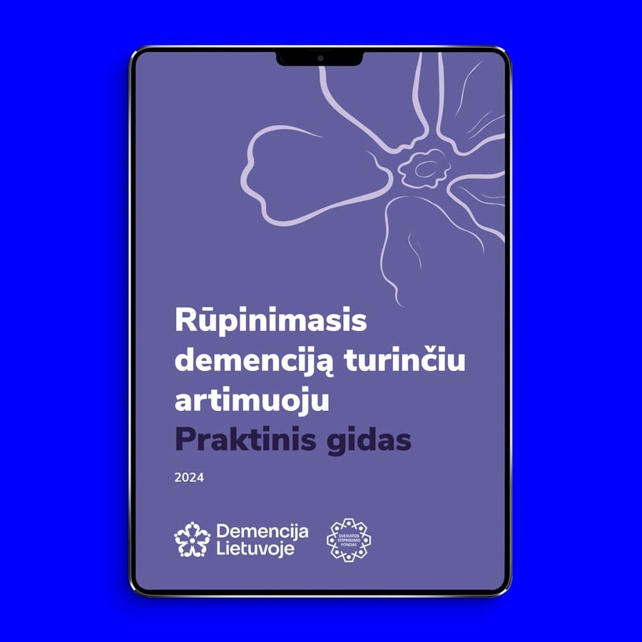 Tablet displaying an accessible digital PDF guide for dementia caregivers, with a purple cover, floral line illustration, and Lithuanian text on a bright blue background.