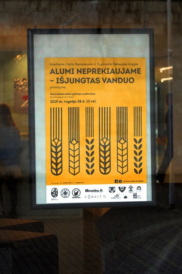 A framed yellow poster announces the presentation of the book “No Beer for Sale — The Water’s Been Cut Off,” decorated with bold black grain illustrations.
