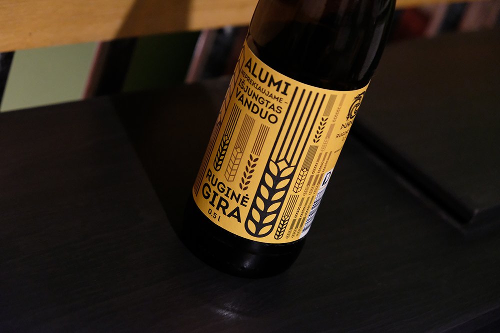 A darkbottle of rye kvass with a yellow label featuring grain graphics and the text “No Beer for Sale — The Water’s Been Cut Off” and “Rye Kvass, 0.5 L.”