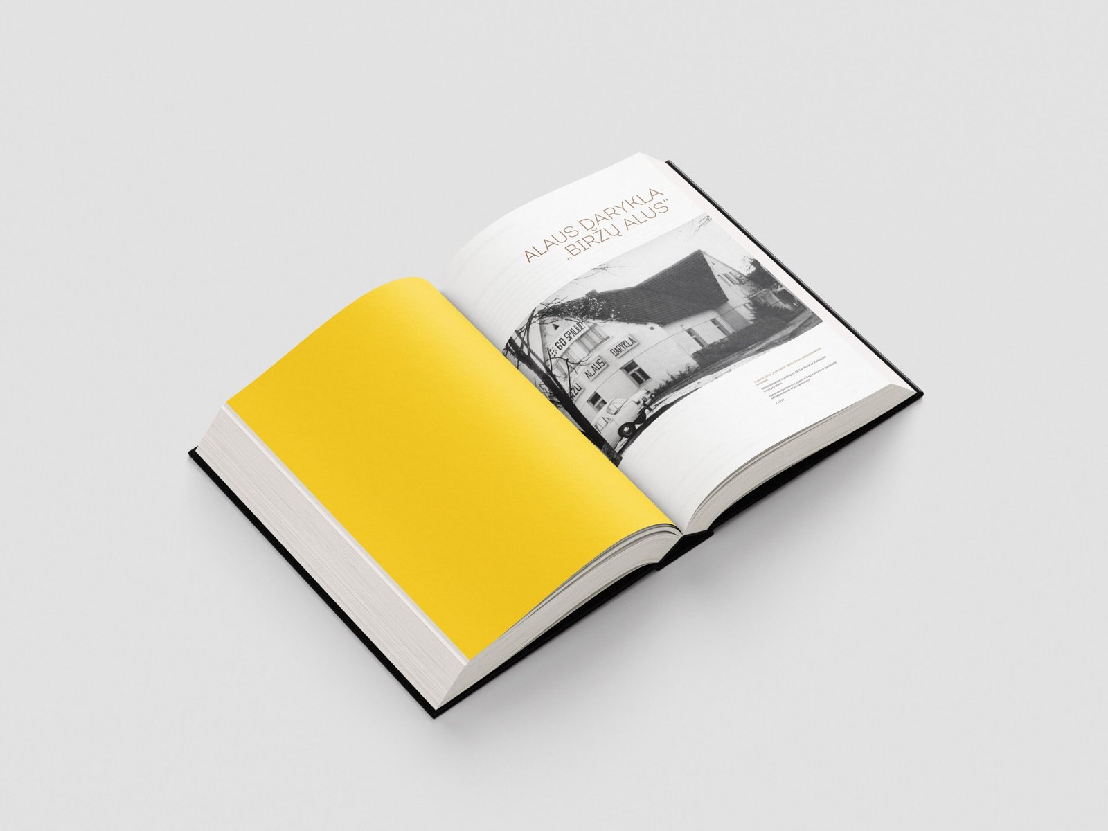 An open book introduces the Biržai beer factory, pairing a bright yellow page with a black-and-white photograph of the brewery building.