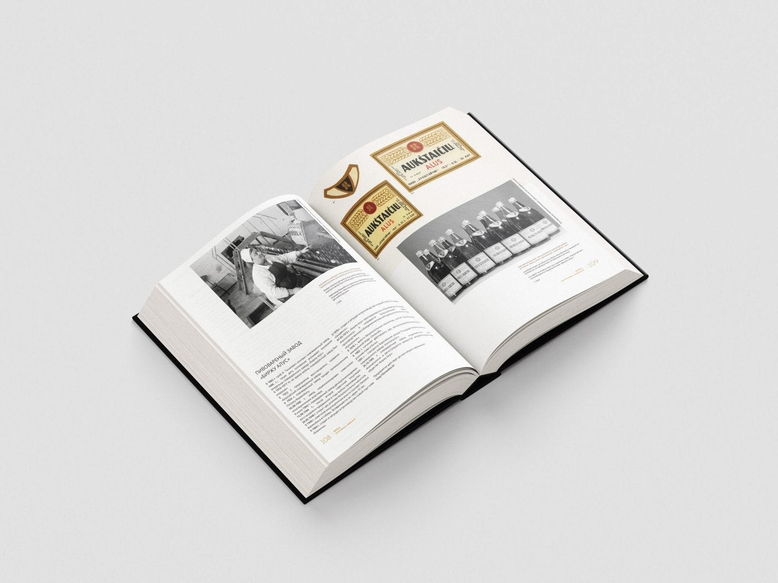 An open book spread presents historic brewery material, including a black-and-white photograph, vintage “Aukštaičių Beer” labels, and a row of bottled drinks.