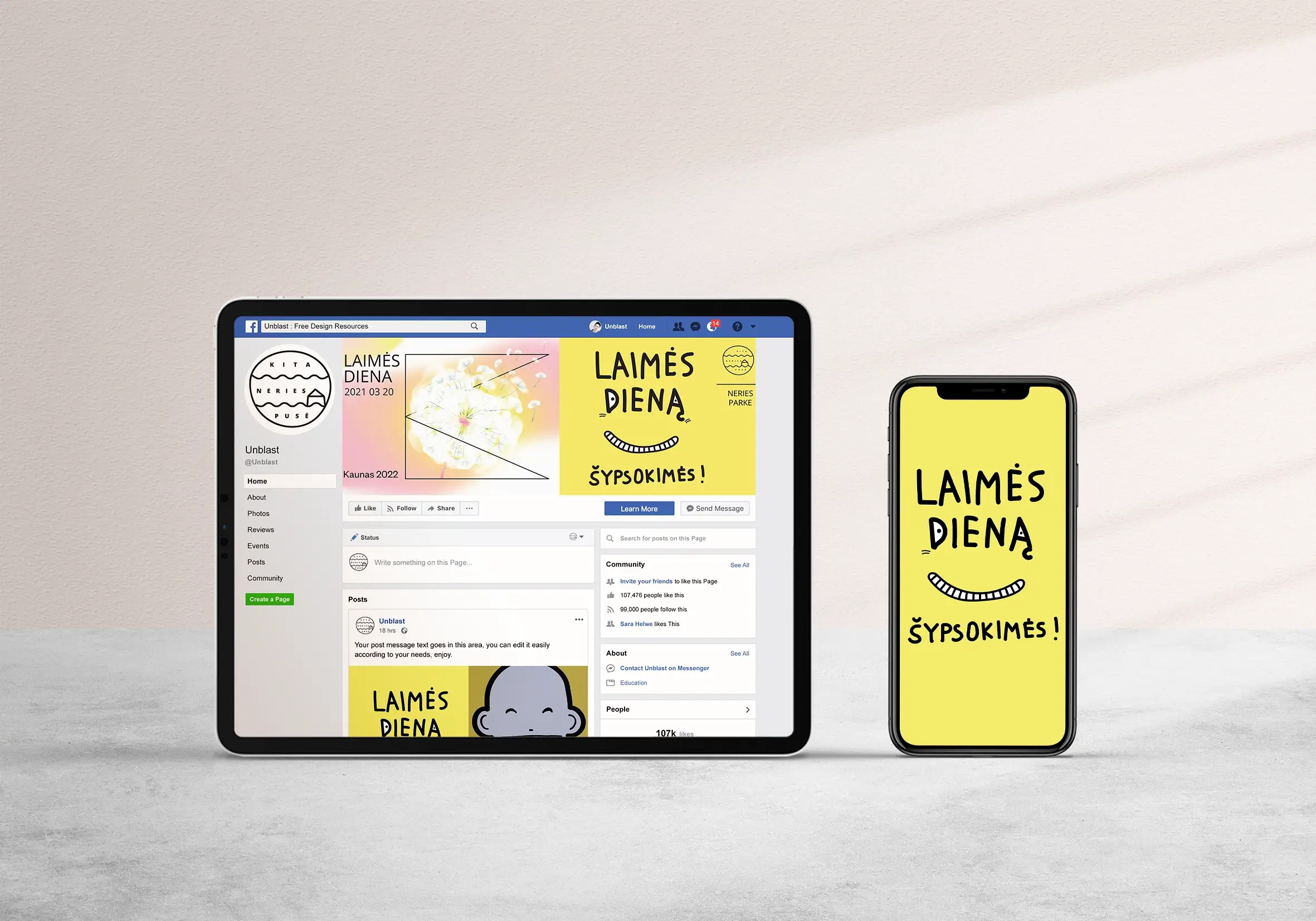 A tablet and smartphone display bright yellow graphics for the “Day of Happiness” event. The phone screen reads “LAIMĖS DIENA. ŠYPSOKIMĖS!” (“Day of Happiness. Let’s smile!”) with a simple curved smile illustration.