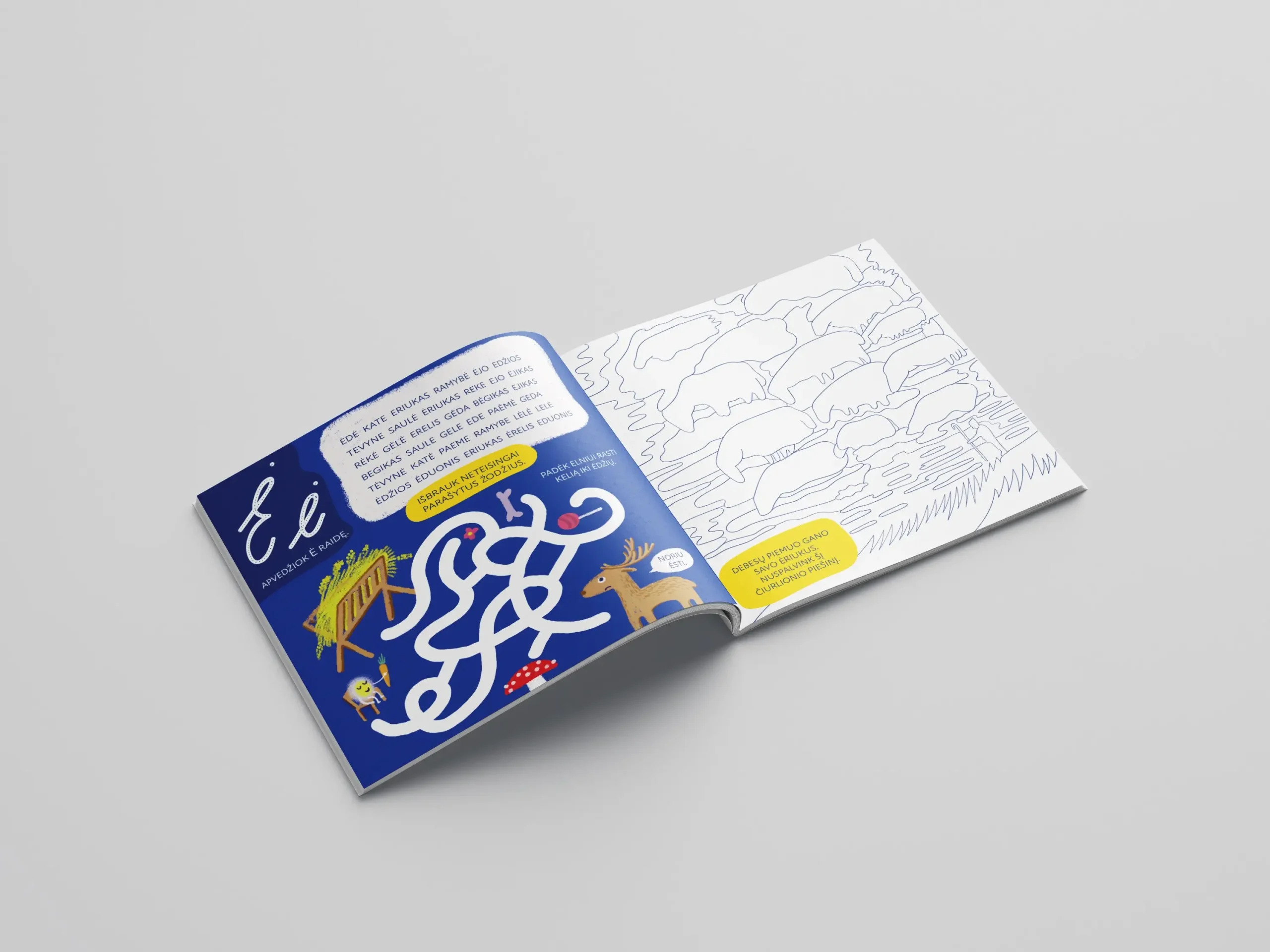 Open workbook with letter Ė puzzles and illustrations alongside a large colouring page based on a Čiurlionis landscape.